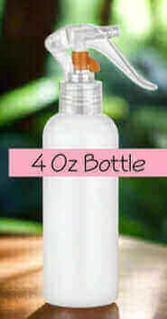 4 oz spray bottle for aroma burner oils and room sprays in a serene setting.